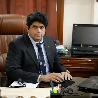 Portrait of Dr. Roshan Kazi, Dean of School of Commerce, Management and Computer Studies